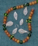 A
few small wire beads on a glass bead necklace